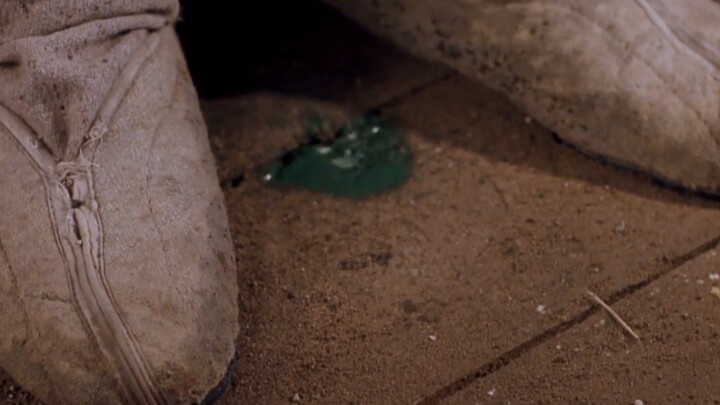 Young man uses an iron pot to block the dissolving acid.