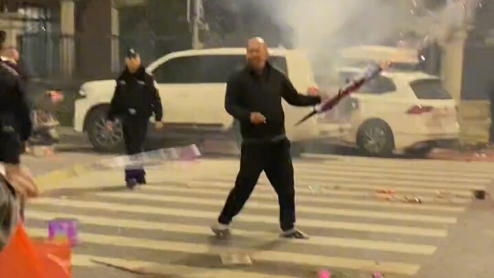 As soon as this guy lit the firework, the police showed up and tried to put it out, but they just co