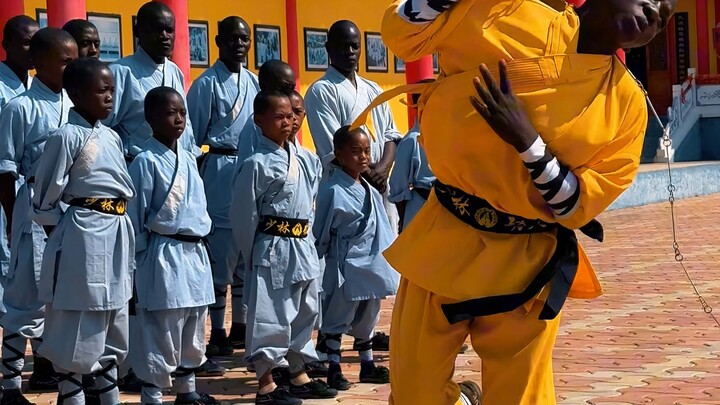 Zambian Shaolin disciples perform the Shaolin Nine-Section Whip on Mount Song.