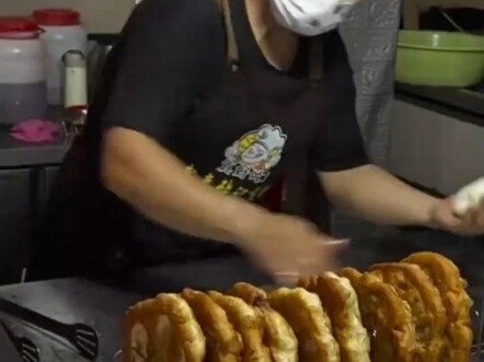 What kind of amazing person could make every vendor on an entire street willingly pause their busine