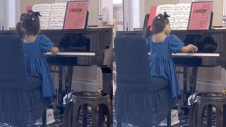 5-year-old girl plays piano with such enthusiasm that she forgets to eat and sleep; she sings happil