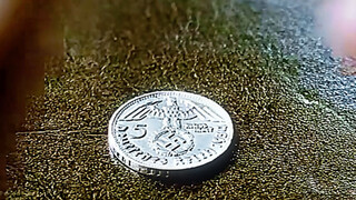 Why can't the young Magneto, who has awakened superpowers, move a small coin?