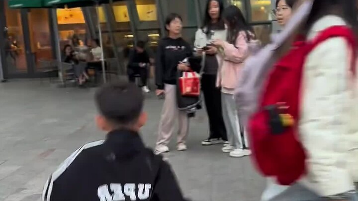 The kid was punching and dancing street dance on the roadside. It was such a show. Was he serious?