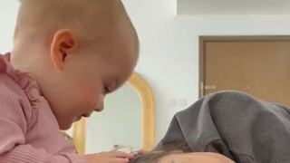 Lie on your baby's lap and see how he reacts...