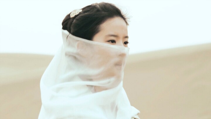 Even with a veil on, you can tell she's a beauty