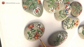 Folk art flowers painted pebbles