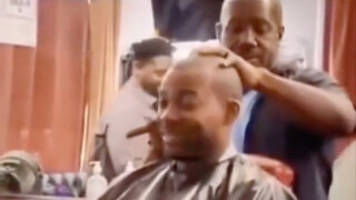 Two black men are in a barber shop, arguing about who is stronger, Whitebeard or Akainu
