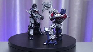 The blackened Optimus Prime is really handsome, holding a double blade and showing both beauty and s