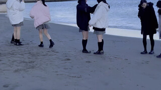 Surrounded by Japanese high school students at the beach