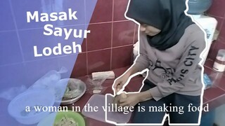 A WOMAN IN THE VILLAGE IS MAKING COOK
