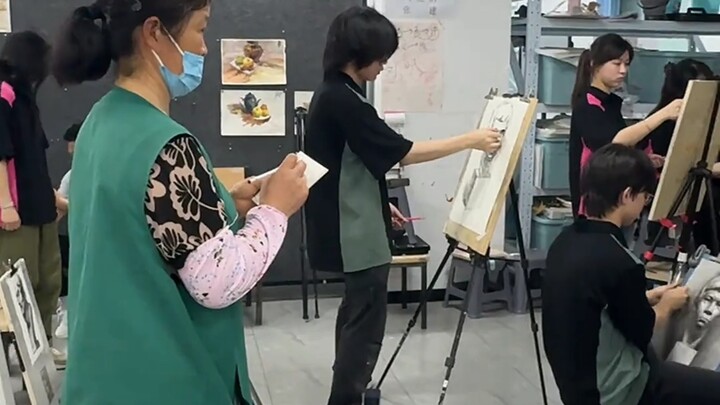 The studio’s 60-year-old cleaning lady looks like this, but her paintings…