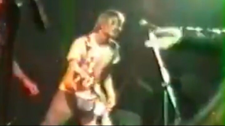 Kurt Cobain spits on a guy on stage