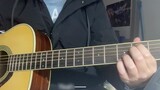 Playing the guitar and singing アイロニ (Irony)