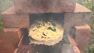 Stacking bricks to make an oven—what else could this be but genius!