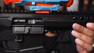 Toy meets real iron? One dares to ask, and the other dares to answer.