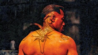 No one dares to confront the black man with this back tattoo!
