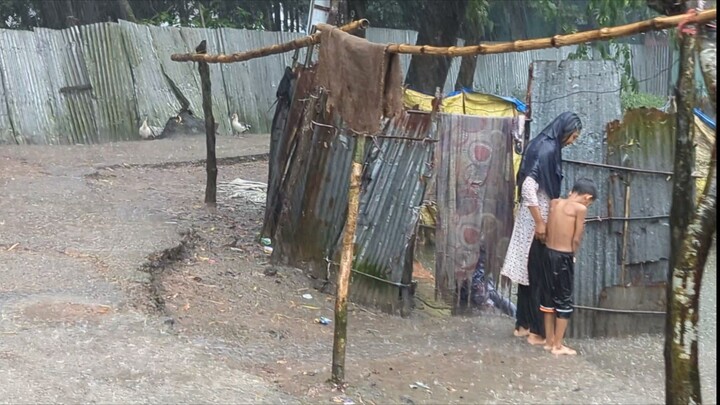 a heavy monsoon rain in the village