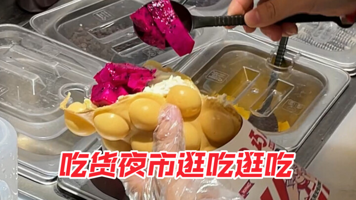That sausage is so long—so satisfying to eat! I went for the dragon fruit cream egg waffle; the youn