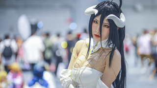 A cosplayer, a handsome man and a beautiful girl.