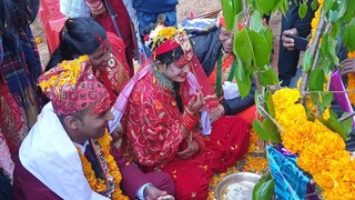 Bride and Groom Sharing Food for First Time in Nepalese Wedding |