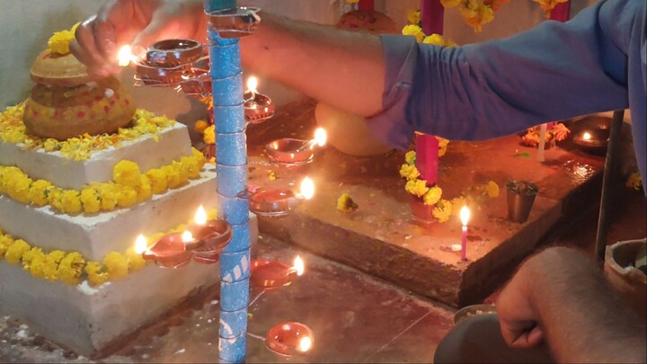 Making diya stand with bamboo stick for indian festival diwali