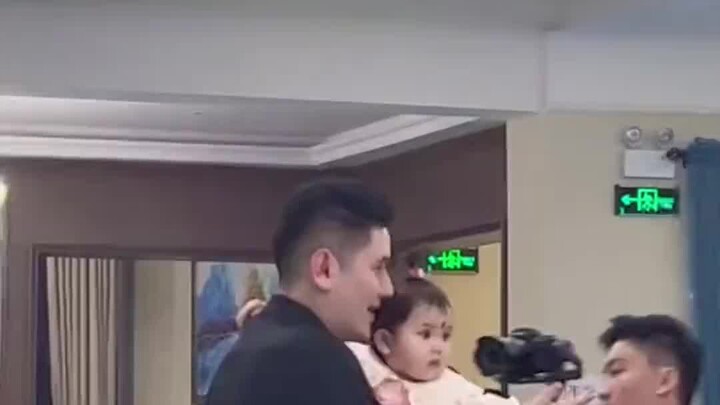 At the family dance, Dad is dancing with his daughter in a princess dress. Mom says: “I’ll teach my 