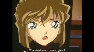 Haibara complaining about her sister to Conan