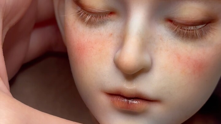 He lowers His gaze to look at you.