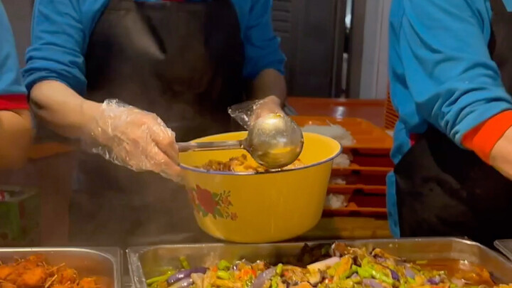 University cafeteria auntie serving food