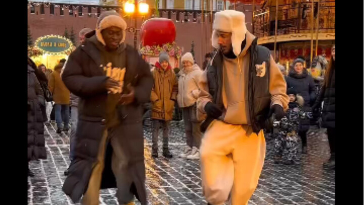 Russian guys are dancing gracefully to traditional Russian songs.