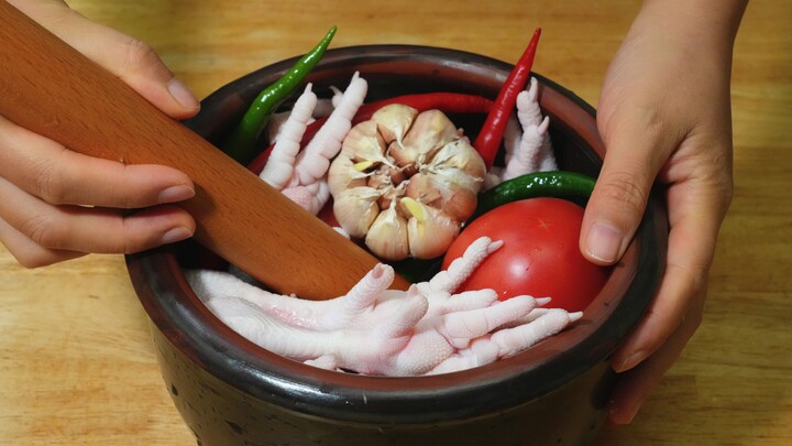 I highly recommend trying this divine way to enjoy chicken feet! Just mash them with a stick, and yo