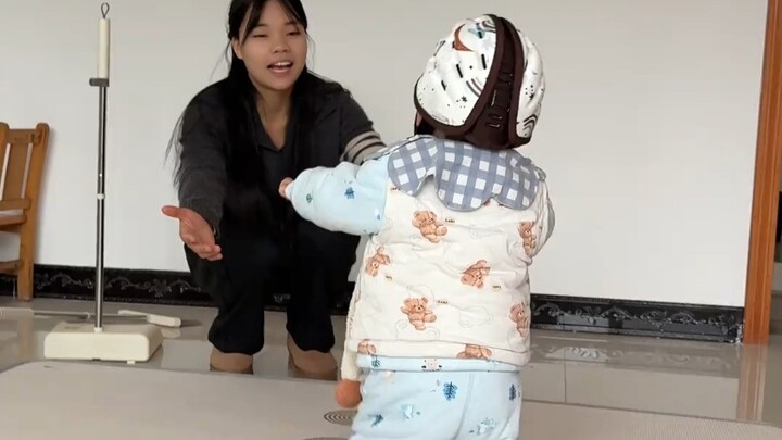 Baby takes their first steps! Mom is so excited!