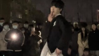 Male college students dancing handsomely on the playground