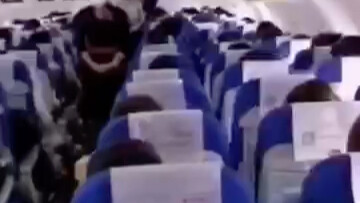 As the chartered flight packed with medical staff approaches Wuhan, a flight attendant chokes back t