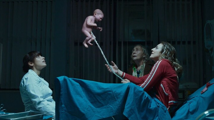 A mother gives birth to a zero-gravity baby that floats into the sky at birth—only the umbilical cor