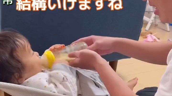 Japanese dad uses baby bottle-feeding to hilariously reenact workplace drinking rituals: “Boss, come