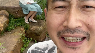 The model sits and shoots shorts—just as long as her feet aren't in the frame!