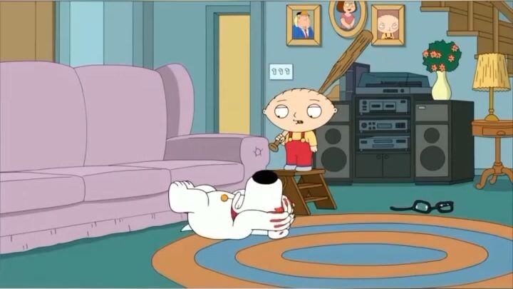 Stewie hits Brian with a baseball bat
