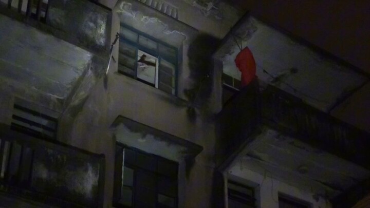 Late at night, I spot a blood-red shirt and venture into the abandoned building to investigate.