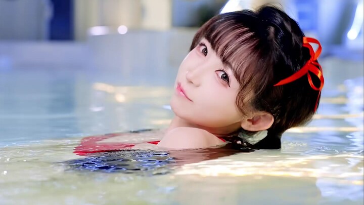 The young lady looks great dancing as a sea monster in a swimsuit!