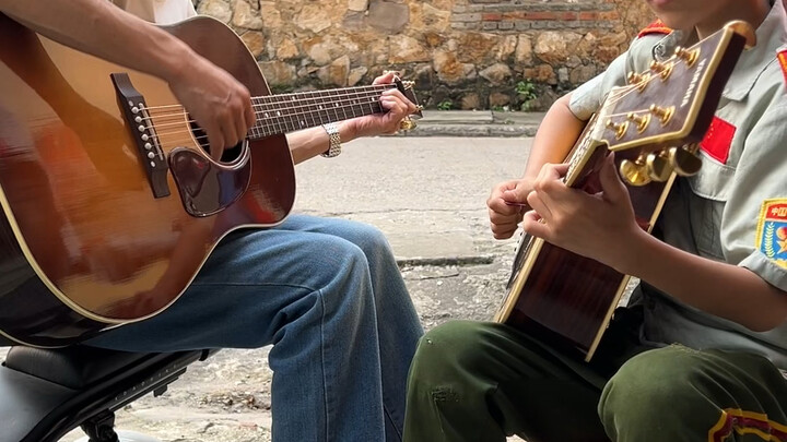 Lovers and father-son duo playing and singing with two guitars