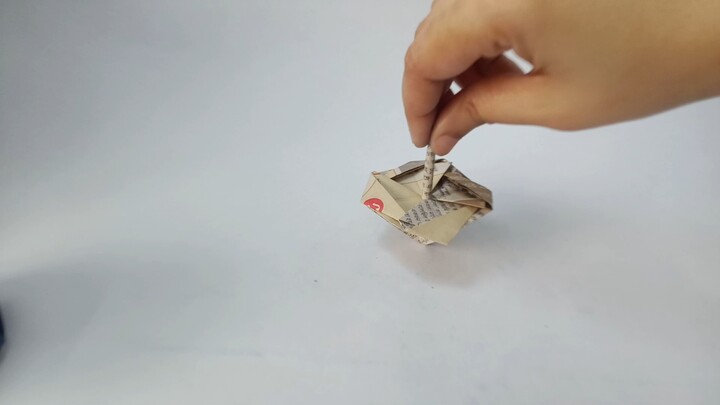 Turning a blue paper into a spinning top 🔵✨ Origami creativity at its best.