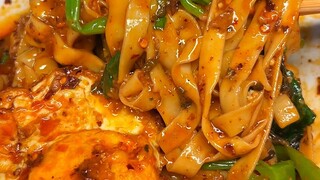 Chongqing's spicy broad bean and pea noodles—loaded with veggies and just a touch of noodles, oh so 