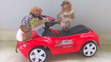 Toto & Yaya are very busy playing checking & playing with the car