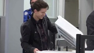 Tom Holland and his younger brother went through security check. The older brother behind him had a 