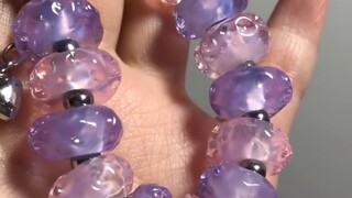 Start by hand-burning beads and string a healing cloud glass bead bracelet