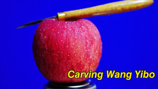 Carving Wang Yibo's face in an apple