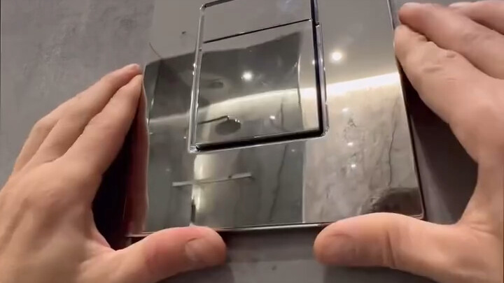 Integrated design of wall tiles and toilet flush button