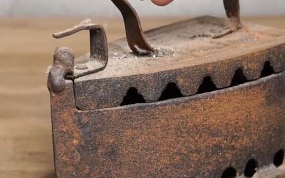 It takes a lot of tools to restore a rusty antique iron and finally put it back into use!