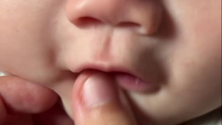 Let’s see if the baby has teeth yet—my phone almost got eaten!